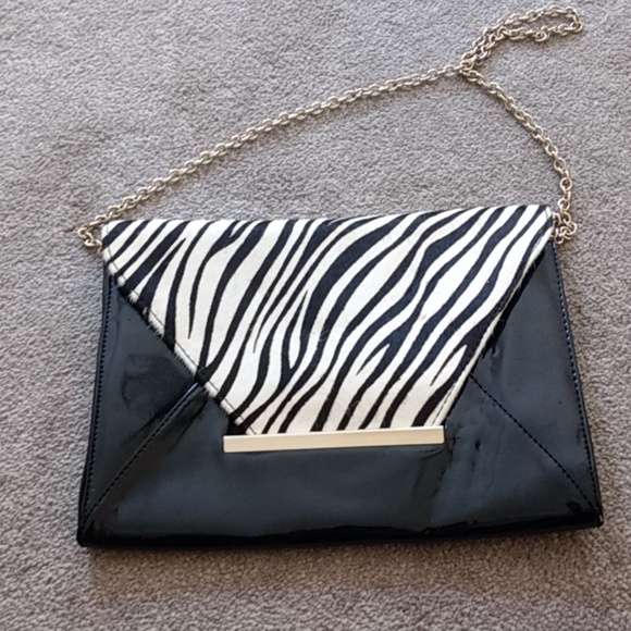 Zebra and black clutch. - Picture 1 of 2